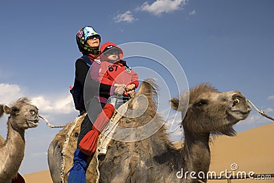 The old woman ride a camel