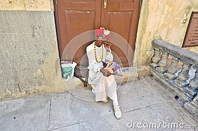 An old woman smoking a huge cigar