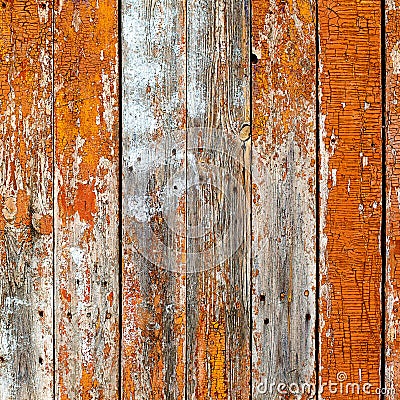 Old wooden planks painted with brown paint cracked by a rustic b