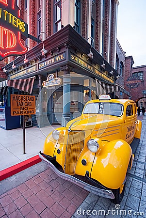 Old yellow taxi in the street view