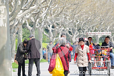 Older Chinese woman walking