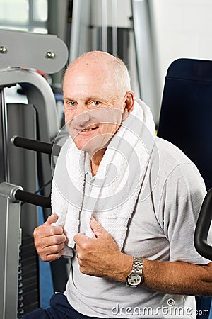 Older man exercising at the gym