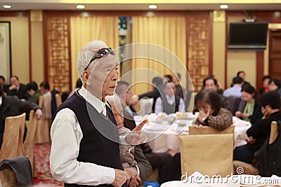 Older people speak at the banquet in a restaurant
