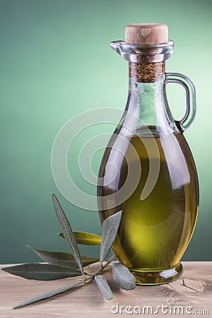 Olive oil bottle with green spotlight background