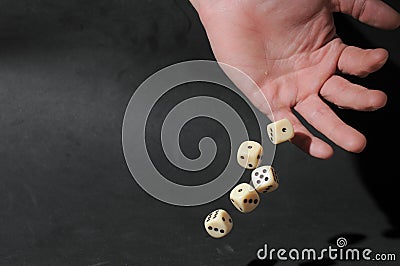 One Left Male Hand Playing Dice