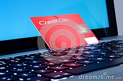 Online shopping, laptop and credit card close up