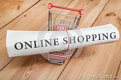Online shopping newspaper and cart