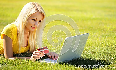 Online Shopping. Smiling Blonde Girl with Laptop