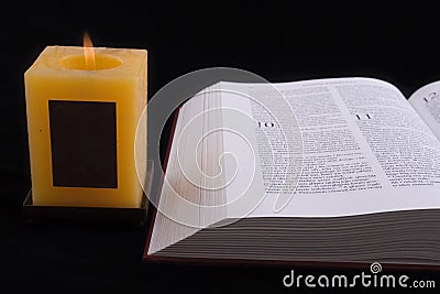 Open Bible and Candle