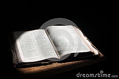 Open bible lying on a table