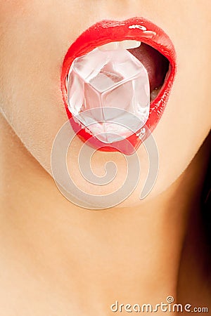 Open red mouth holding an ice cube