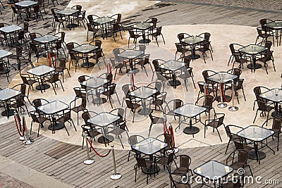 Open square tables and chairs,