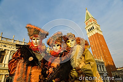 Orange costumed masked group