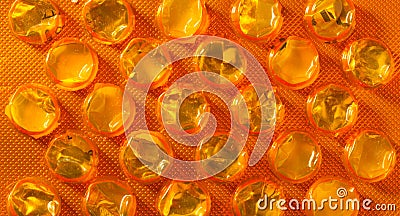 Orange package of pills tablets drug medicine as background