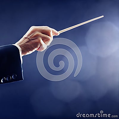 Orchestra conductor hand conducting