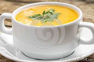 Organic food. Pea soup in a bowl on wood background