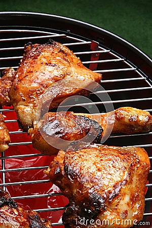 Organic roasted chicken parts on a barbecue