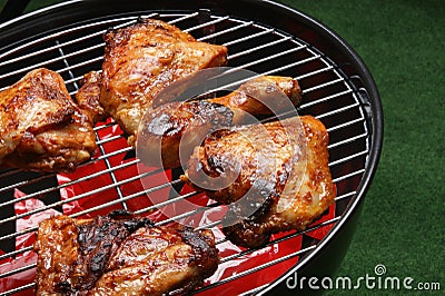 Organic roasted chicken parts on a barbecue