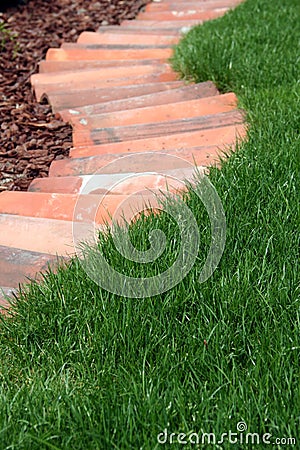 Ornamental garden bed and lawn grass path