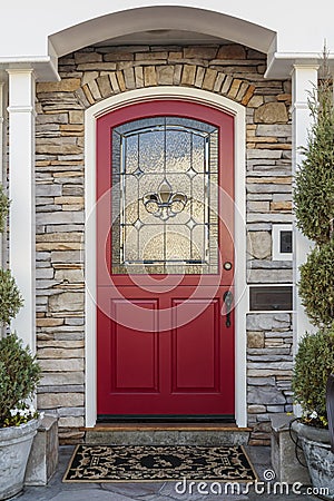 Ornate red front door of a home