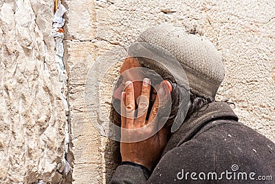 Orthodox Jewish Man prays at the western wall