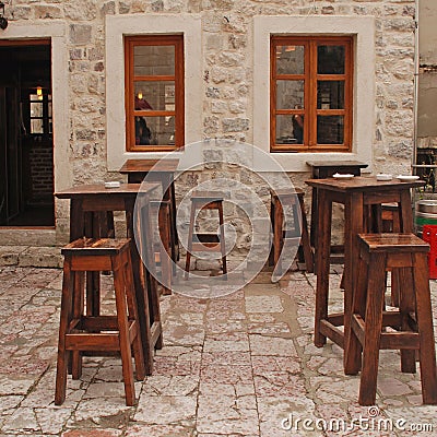 Outdoor cafe with wooden furniture
