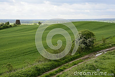 Outside the city - rural landscape - an old windmill on the fiel