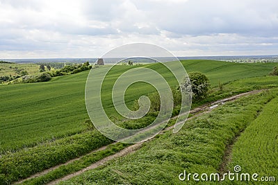 Outside the city - rural landscape - an old windmill on the fiel