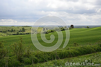 Outside the city - rural landscape - an old windmill on the fiel