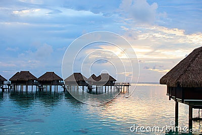 Over water villas at sunset