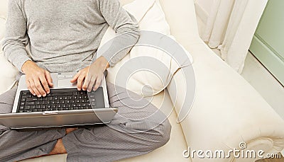 Overhead view of professional man with laptop and smart phone at home.
