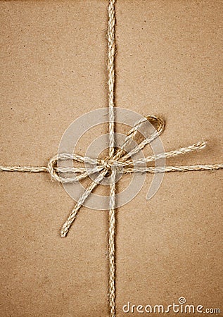 Package in brown paper tied with string