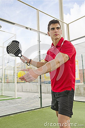 Paddle tennis player ready for serve