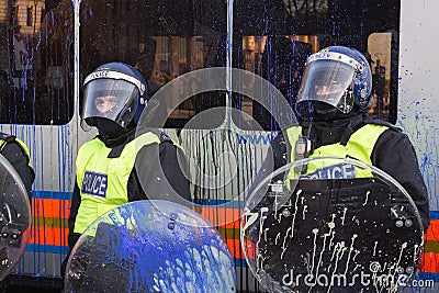 Paint splattered UK riot police,London,UK.