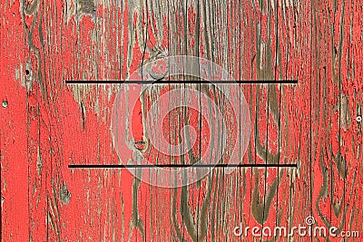 Painted wooden background with exfoliated red color