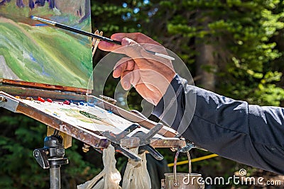 Painter Hand Brush and Easel