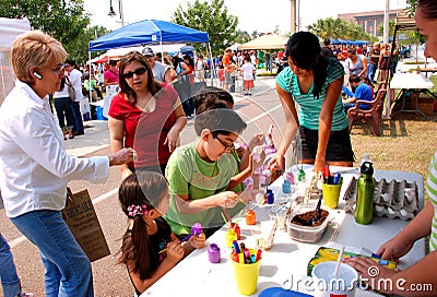 Painting eggshell planter at Earth Fest