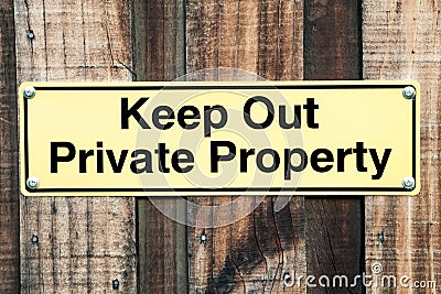 Pale Yellow and Black Sign Stating Keep Out Private Property