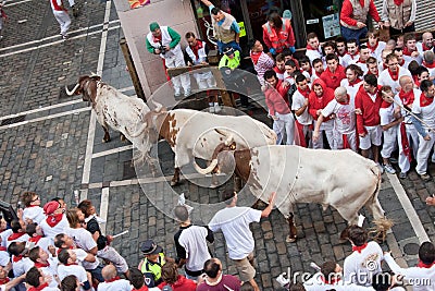 PAMPLONA, SPAIN -JULY 8: Bulls run down the street