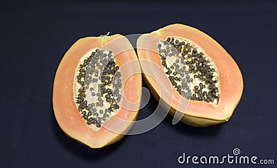 A papaya fruit cut in half