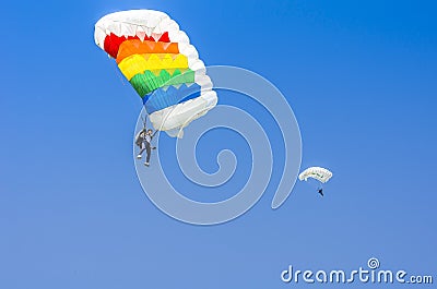 Parachute jumpers in the sky