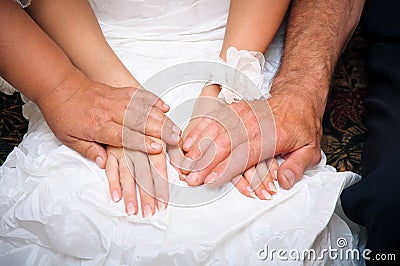 Parents blessing and supporting for bride in a wedding dress