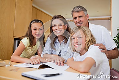 Parents helping their children with homework