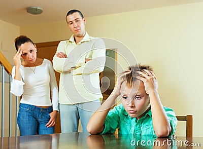 Parents and teen son after quarrel at home