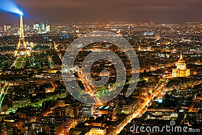 Paris at night with the Eiffel tower.