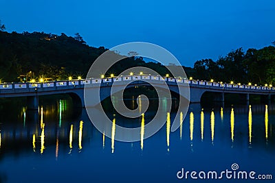 Park with lake and bridge