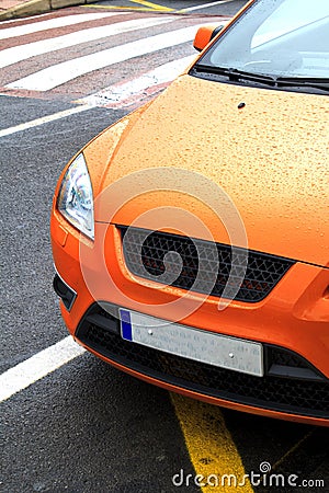 Parked orange sports car