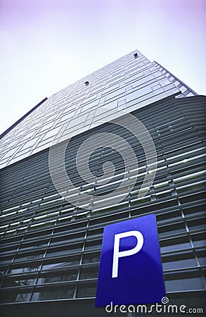 Parking sign and office building