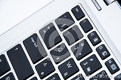 Part of a laptop keyboard on a white background