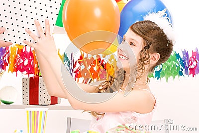 Party girl with balloons and gift box